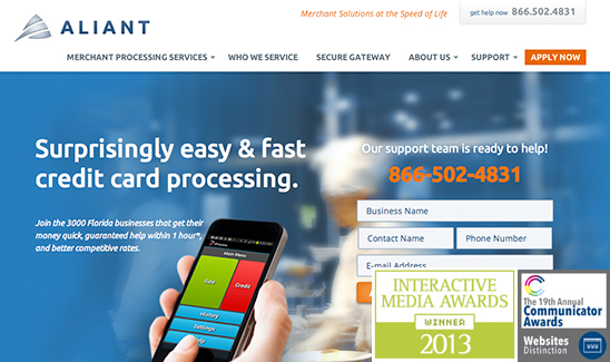 Home page of Aliant website displaying an advertisement for credit card processing services, featuring a smartphone with app buttons and contact information. Several award logos, including PaperStreet Wins Multiple Awards in 2013, are present at the bottom.