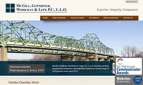 Screenshot of McGill, Gotsdiner, Workman & Lepp, P.C., L.L.O.'s website. The image includes a bridge, company name, tagline "Expertise. Integrity. Compassion," and an award graphic for the 19th Annual Communicator Awards. PaperStreet Wins Multiple Awards in 2013 also acknowledged at this event.