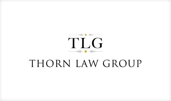 Logo of Thorn Law Group featuring "TLG" in bold letters above "Thorn Law Group," with small decorative elements on a white background. This best law firm logo design captures sophistication and professionalism effortlessly.