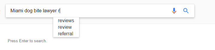 Google search bar with the typed query "Miami dog bite lawyer r" and autocomplete suggestions including "reviews," "review," and "referral.