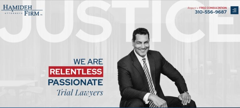 Promotional image for Hamideh Firm with a smiling man in a suit. Text reads, "We are relentless, passionate trial lawyers. Request a free consultation 310-556-9687." Large word "JUSTICE" in the background.