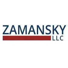 Logo of Zamansky LLC featuring the company name in blue uppercase letters with a red underline beneath "Zamansky". "LLC" is displayed in smaller blue text right-aligned under the underline.