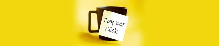 A black mug with a sticky note labeled "Pay Per Click" against a yellow background.