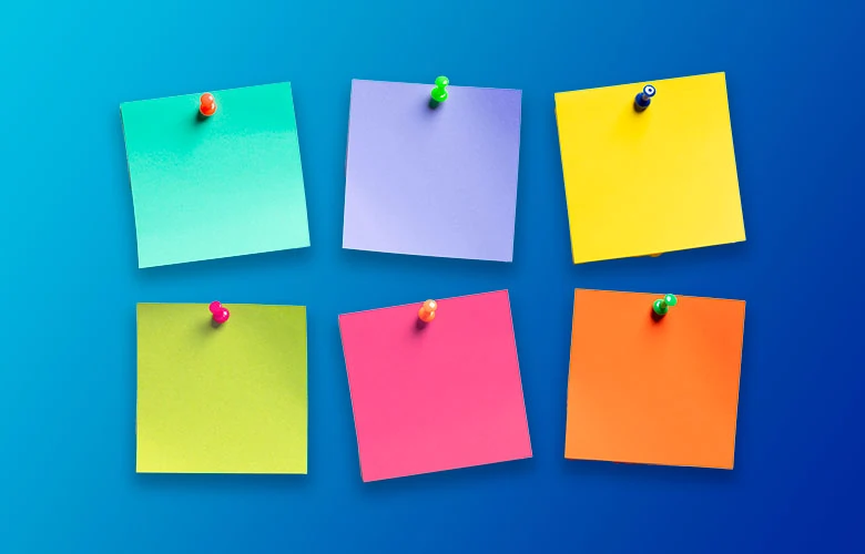 Six colorful sticky notes with thumbtacks pinned on a blue gradient background.