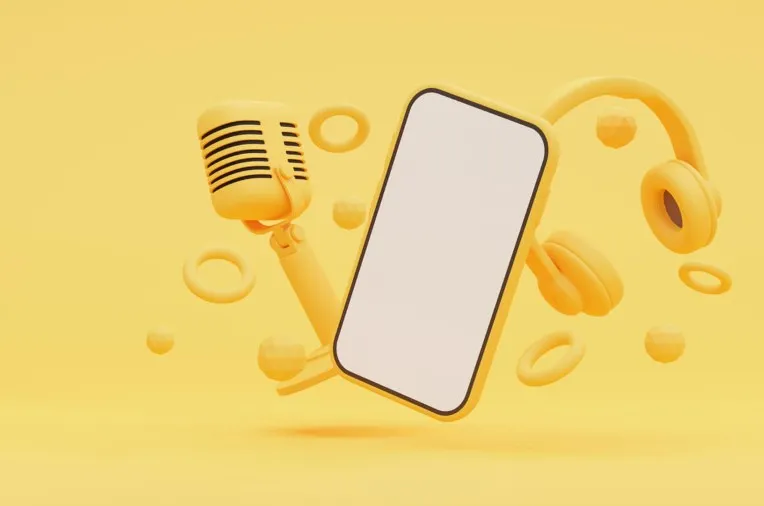 A smartphone, microphone, and headphones, all in yellow, are floating against a yellow background with scattered geometric shapes. The smartphone's screen is blank.