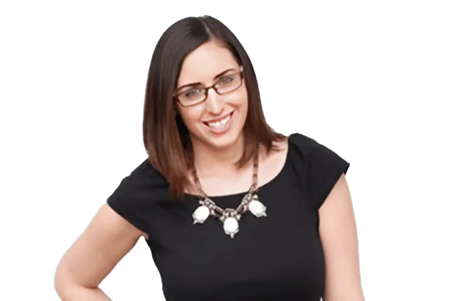 Woman wearing glasses and a black shirt, smiling at the camera.
