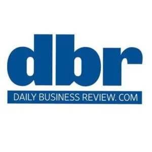 Logo of Daily Business Review with the abbreviation "dbr" in large blue letters and the website address "DAILYBUSINESSREVIEW.COM" beneath it.