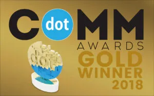 DotCOMM Awards Gold Winner 2018 logo with a stylized trophy featuring the dotCOMM symbol on a golden background.