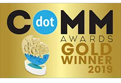 Gold plaque showing "COMM Awards Gold Winner 2019" with a blue and white dot logo.
