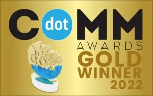 A gold background image features the text "dotCOMM Awards GOLD WINNER 2022" along with a dotCOMM Award trophy.