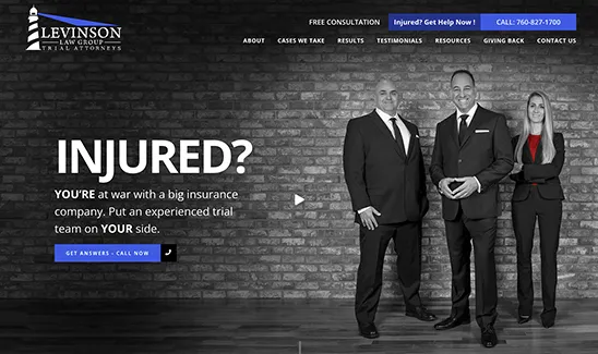 Three legal professionals stand against a brick wall. Text on the left reads: "INJURED? You're at war with a big insurance company. Put an experienced trial team on your side.