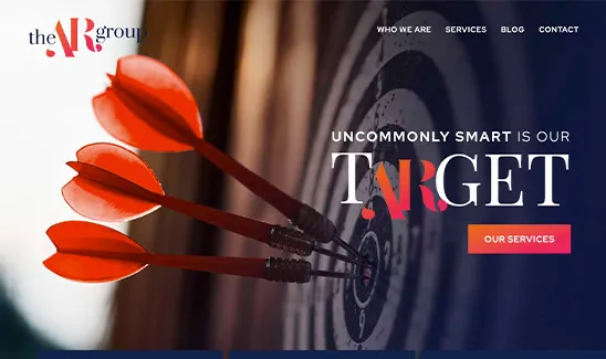 Three red darts hitting the bullseye of a dartboard with the AR Group logo and the text "Uncommonly smart is our target." Navigation options include "Who We Are," "Services," "Blog," and "Contact.