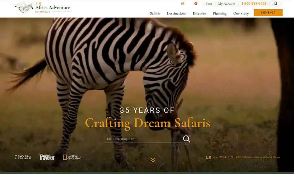 Screenshot of The Africa Adventure Company's website homepage featuring a zebra grazing and a banner that reads, "35 Years of Crafting Dream Safaris." Various navigation options are visible at the top.