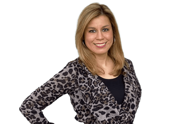 A woman with shoulder-length blonde hair is smiling. She is wearing a leopard-print top over a black shirt.