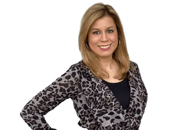 A woman with shoulder-length blonde hair is smiling. She is wearing a leopard-print top over a black shirt.