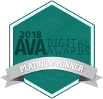 A teal hexagonal badge with the text "2018 AVA Digital Awards" and "Platinum Winner" on a silver banner across the center.