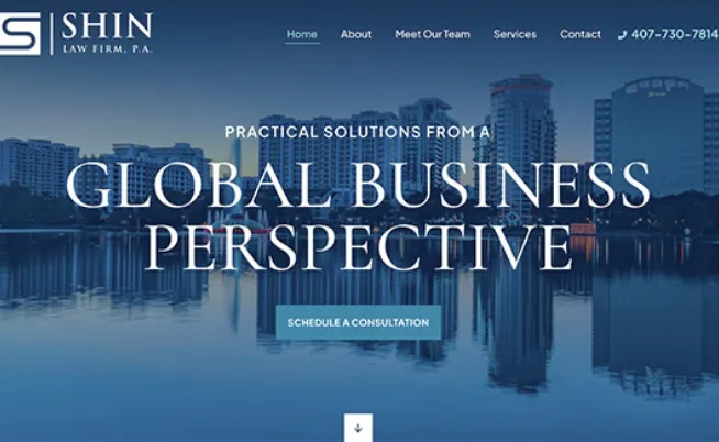Website homepage of Shin Law Firm, P.A., featuring a city skyline and water reflection, with text promoting global business solutions and a button to schedule a consultation.