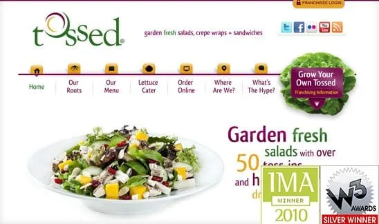 Website homepage of a restaurant named Tossed, featuring a salad image, navigation menu, and award graphics for IMA 2010 Winner and W3 Silver Winner. The tagline highlights fresh salads with over 50 toss-ins.