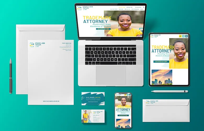 A laptop, tablet, smartphone, and various stationery items display branding for a trademark attorney service, featuring a logo, contact details, and a smiling woman on the digital screens.