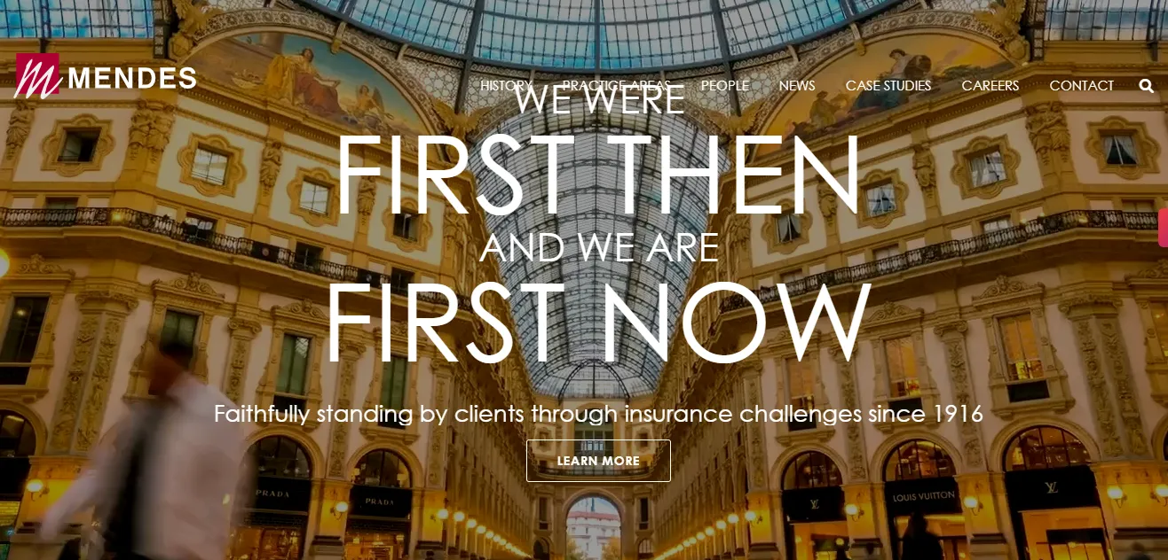 Interior view of a grand building with ornate architecture, featuring a large glass dome ceiling. Text reads, "We were first then and we are first now." Company name Mendes is displayed at the top left.