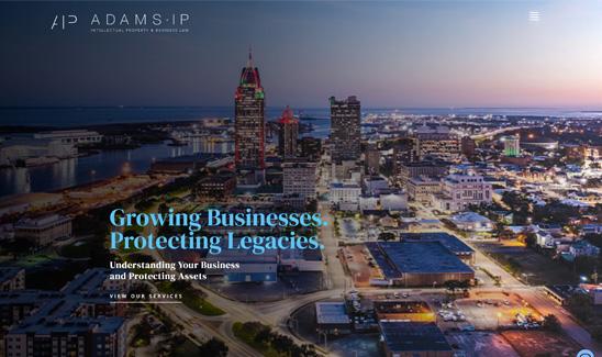 Aerial view of a cityscape at dusk with buildings and streets illuminated. Text reads “Growing Businesses. Protecting Legacies. Understanding Your Business and Protecting Assets.”.