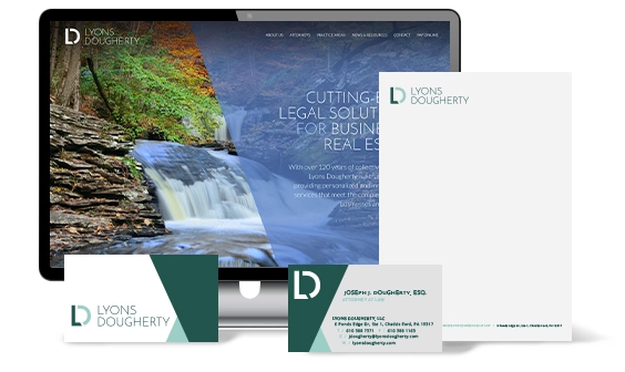 A computer screen showing a website and a letterhead, business card, and envelope with the branding of "Lyons Dougherty." The screen displays a nature scene and the text "Cutting-edge legal solutions for business and real estate.