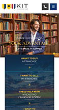 A smiling person in a library is featured on an informational webpage. The page includes a navigation menu with options to buy, sell, or get help with a franchise. The header reads, "YOUR ADVANTAGE.