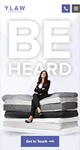 A woman in business attire sits confidently atop a stack of large white, gray, and black books. Above her, large white text reads "BE HEARD." The bottom shows a "Get in Touch" button with an arrow.