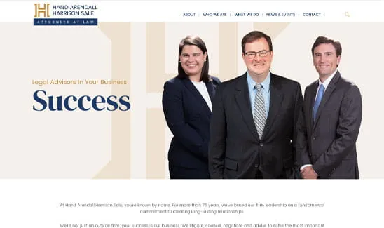Three people in professional attire stand on a webpage for Hand Arendall Harrison Sale law firm. The heading reads, "Legal Advisors In Your Business Success." The firm's logo is displayed at the top.