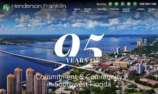 Aerial view of a city with bridges over water. Text overlay reads "95 Years of Commitment & Community in Southwest Florida" with the company name "Henderson Franklin, Attorneys at Law" at the top.