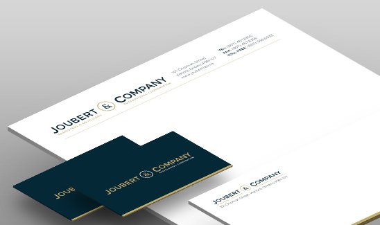 A business stationery set featuring Joubert & Company branding, including letterhead and two dark blue business cards with gold trim.