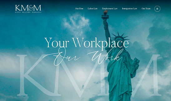 Website homepage of KM&M law firm, displaying the Statue of Liberty and navigation links for legal services including labor law and immigration law.