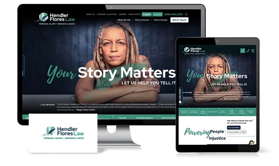 Desktop computer, tablet, and business card displaying the website of "Hendler Flores Law," featuring a woman with dreadlocks and the text "Your Story Matters. Let Us Help You Tell It.