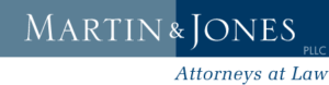 Logo of Martin & Jones, Attorneys at Law, with "Martin & Jones" in white text on a blue background and "PLLC" beside it. Below is the phrase "Attorneys at Law" in smaller blue letters.