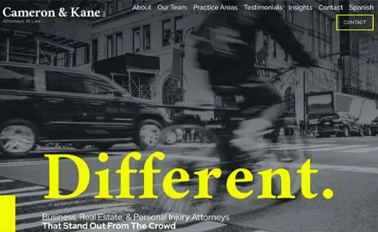Black and white image of a busy street with a yellow overlay headline that reads "Different." The company name "Cameron & Kane" and website navigation options are visible at the top.