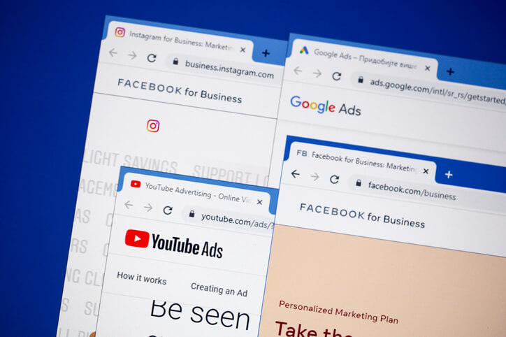 Several web browser tabs are open to different digital advertising platforms, including Instagram for Business, Facebook for Business, Google Ads, and YouTube Advertising.