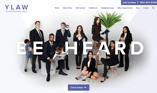 A group of people in professional attire, some holding children and books, pose for a photo on YLAW's website with the words "BE HEARD" prominently displayed.