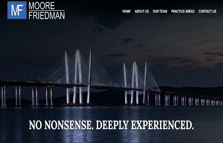 A nighttime view of an illuminated bridge over water with the text "No Nonsense. Deeply Experienced." The website header reads "Moore Friedman" and includes navigation links.