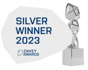 Silver Winner 2023 Davey Awards plaque next to a geometric silver trophy.