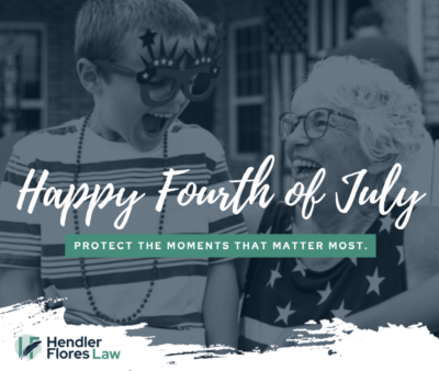 Child and older woman smiling together, both wearing star-themed Fourth of July clothing.