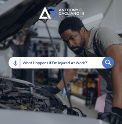 Mechanic inspects car engine in garage; search bar asks about injuries at work.