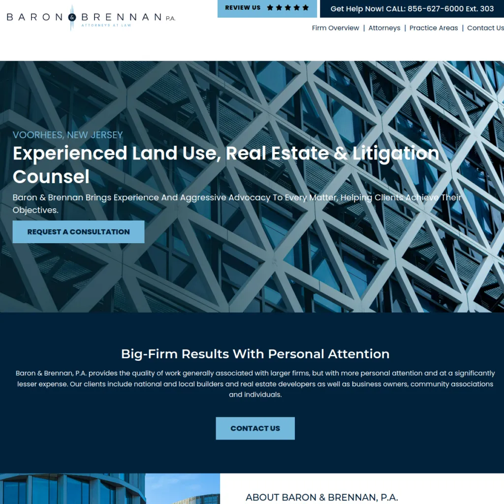 Close-up of modern building facade with website text for a law firm specializing in real estate.