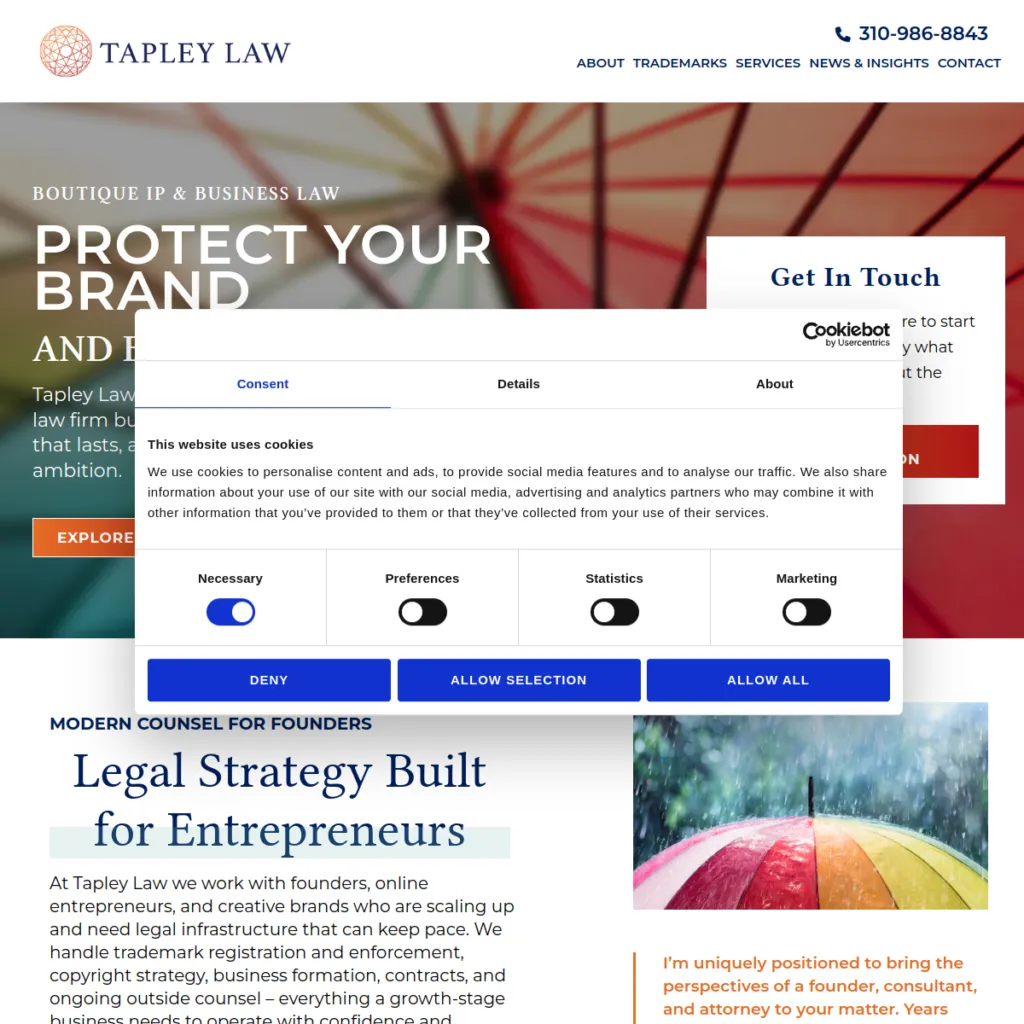 Tapley Law website homepage with cookie consent popup and navigation menu visible.
