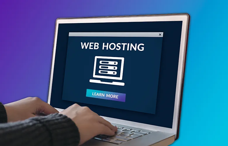 Person using a laptop displaying a web hosting advertisement with a “learn more” button.